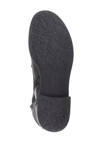 Suela de zapato negra con agarre de goma texturizado, que presenta un tacón plano y el nombre de la marca "Gabor" en relieve. Cortado de una parte superior de cuero aerodinámica.