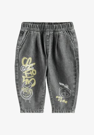 Halli teksari püksid elastse vöökohaga, millel on helekollaste ja valgete trükitud graafikatega, sealhulgas karu ja tekstimustrid.