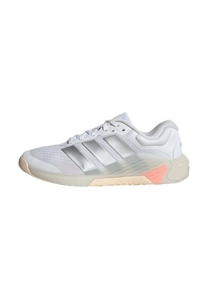 White athletic shoe with a mesh upper, three reflective stripes, textured midsole, and rubber outsole featuring a slight peach accent.