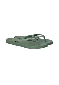 Groene flip-flops met gestructureerde zolen en patroonbandjes. De bandjes hebben een golfontwerp, wat een contrast vormt met de effen basis.