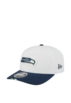 White and navy baseball cap featuring a stylized hawk logo on the front and a small emblem on the side.