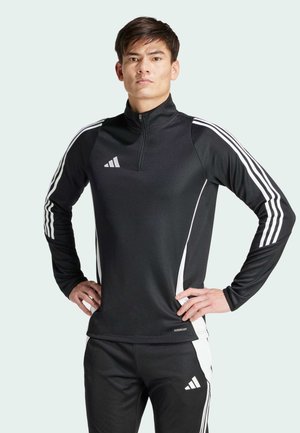 Zwarte sportieve zip-up top met lange mouwen, witte zijstrepen en logo op de borst. Combinatie met bijpassende zwarte broek. Prestatiedoek.