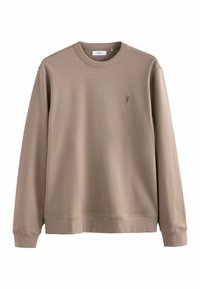 Sweat-shirt beige à manches longues avec un col rond et des poignets côtelés. Arbore un petit logo sur la poitrine. Fabriqué en tissu doux.