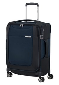Valigia rigida blu navy con un compartimento principale con zip, manico retrattile e quattro ruote multidirezionali. Dotata di una tasca laterale e serratura a combinazione.
