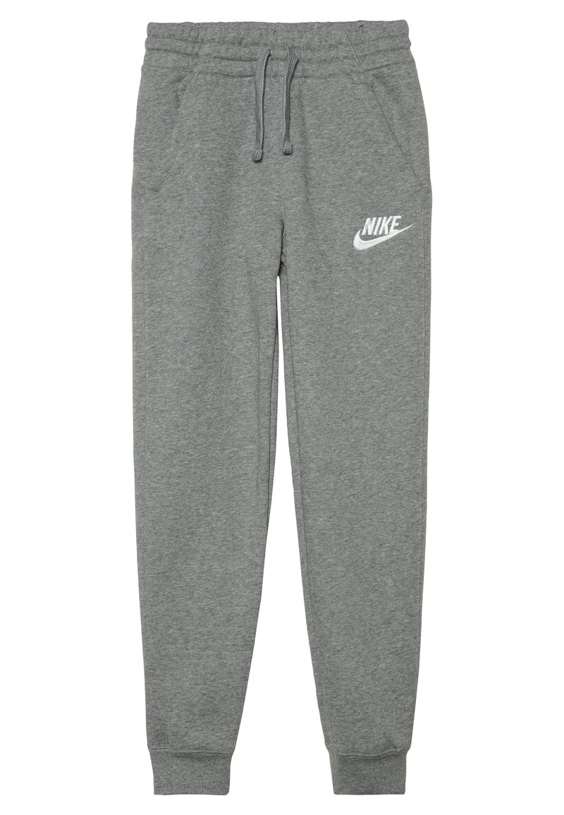 Pantaloni sportivi grigi Nike realizzati in tessuto morbido con vita elastica, coulisse, tasche laterali e logo bianco sulla coscia sinistra.