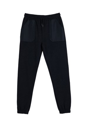 Pantalones de chándal negros hechos de una tela suave con puños elásticos y una cintura con cordón. Presenta dos grandes bolsillos laterales con un ribete en contraste.