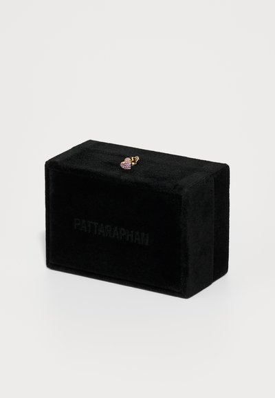 Black velvet jewelry box featuring a small heart-shaped earring with purple gems and gold accents, engraved with "PATTARAPHAN."