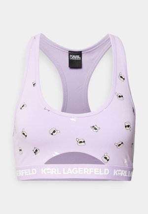 Lilla spordirinnahoidja, millel on rida seljaosa disain. Omab korduvaid graafilisi trükiseid cartoon figuredega, kes kannavad prille, ja valget bränditud elastset vöö. 