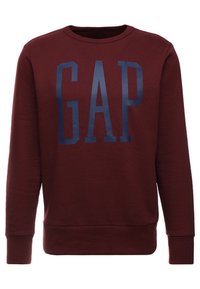 Felpa girocollo bordeaux con grande logo "GAP" blu scuro sul petto, maniche lunghe e polsini e orlo a coste.