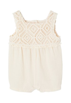 Baby-Strampler in Cremefarben mit ärmellosem gehäkeltem Oberteil mit Diamantmustern und weichem Stoffunterteil.