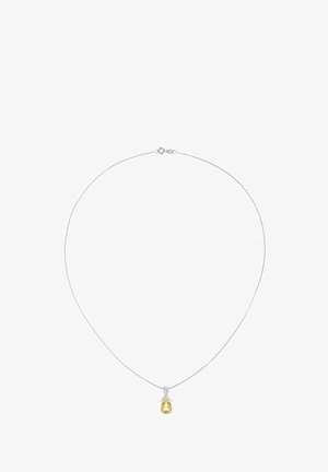 Hõbedast ketiga kaelakee, millel on pisarakuju kollasest vääriskivist ripats, kinnitatud väikese luku abil. Tekstureeritud metallist lingid läikiva viimistlusega.