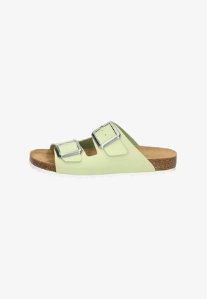 Green slip-on sandals with two adjustable silver buckles, cork footbed, and white rubber outsole, featuring a smooth finish and open design.