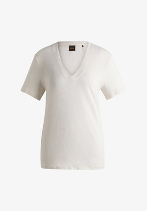 T-shirt a V scollo in beige chiaro; realizzato in tessuto morbido con maniche corte; presenta una leggera lucentezza, etichetta con il marchio sul collo e vestibilità comoda.