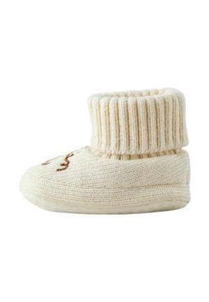 Cream-colored knitted baby slipper with a folded ribbed cuff and brown embroidered animal face on the front.