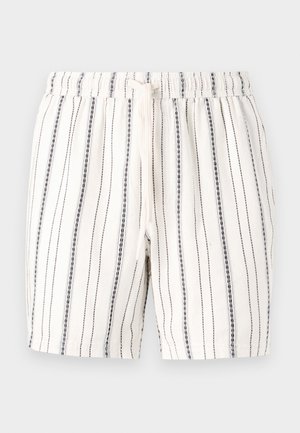 Shorts blancs à rayures verticales bleu marine, avec une taille élastique et un cordon de serrage. Texture douce avec un design léger et décontracté.