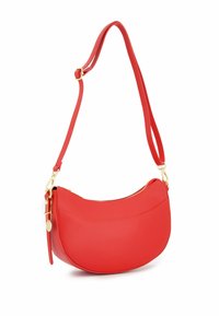 Red leather crossbody bag with a curved shape, gold hardware, and a zippered closure. Features a single adjustable strap for shoulder wear.