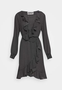 Vestido negro con lunares blancos, mangas largas, con volantes en el frente y el dobladillo, cintura ceñida con cinturón, tela suave y escote redondo.