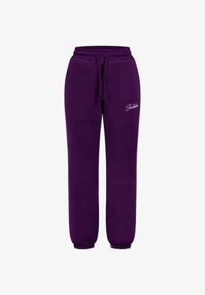 Pantaloni della tuta viola realizzati in materiale morbido, con vita regolabile, polsini elasticizzati e un piccolo logo bianco sul lato sinistro.