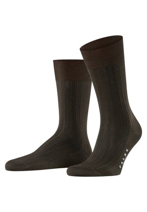 Dark brown ribbed socks with a lighter brown ribbed cuff, seamless toe, and subtle branding pattern at the ankle.