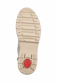 Shoe sole with a textured, light beige rubber surface. Features deep grooves for traction and a red circular accent labeled "Comfort." Size 37.