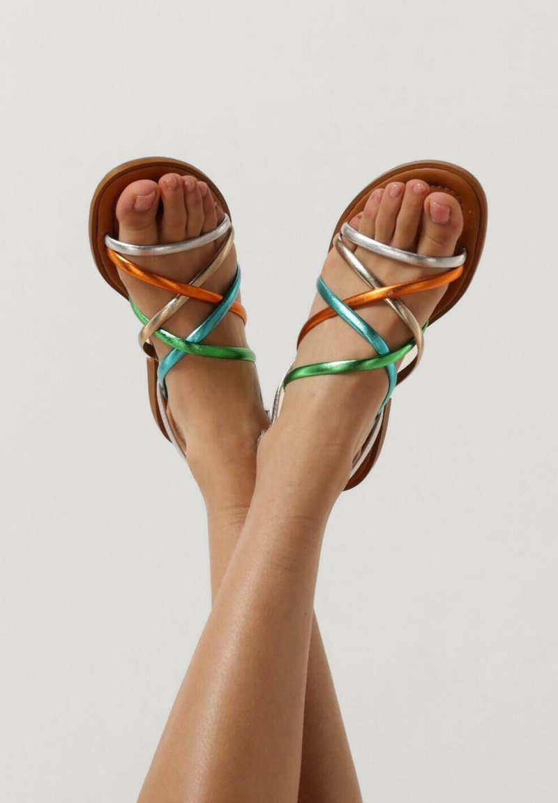 Brown flat sandals with multicolored metallic straps in orange, green, silver, and blue, featuring a strappy design and open toe style.