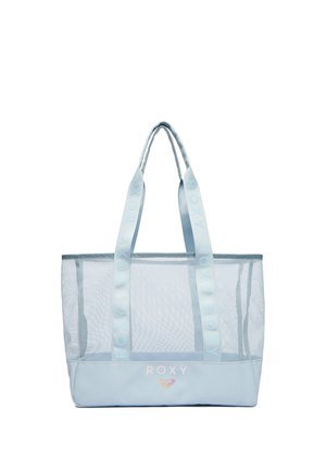 Jasnoniebieska siatkowa torba typu tote z logo "Roxy" na spodzie, z szerokimi uchwytami z powtarzającym się brandingiem "Roxy".