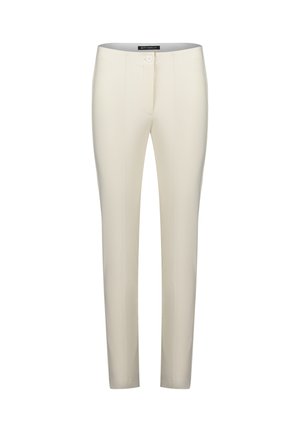 Pantalons sur mesure de couleur crème, à coupe slim, avec fermeture à bouton sur le devant et détails de couture sur les côtés. Fabriqués en tissu extensible.