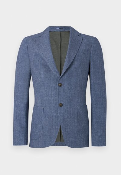 Niebieska marynarka z fakturowanej tkaniny, z dwiema przednimi kieszeniami, klapami i dwoma guzikami. Wnętrze wykończone jest jednolitym zielonym materiałem.