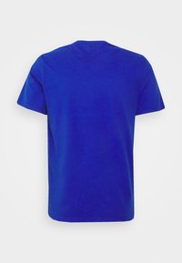 Short-sleeve t-shirt in solid blue cotton. Regular fit, round neck, smooth texture, and no visible patterns or accents. Back view shown.