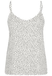 Camisola a pois bianca e nera con spalline sottili, tessuto morbido e scollatura a V, caratterizzata da un design ampio e fluido.