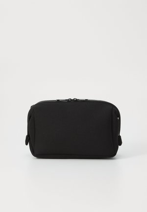 Black rectangular pouch made of soft fabric with a zip closure and rounded corners. No visible patterns or hardware details.