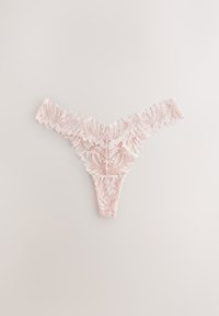 Light pink lace thong underwear with floral patterns, laid flat on a neutral background.