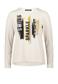 Kremowa koszulka z długim rękawem i okrągłym dekoltem, z czarno-złotym tekstowym wzorem "Smile Sparkle Shine".