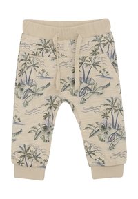 Crème kleurige joggerbroek met een palmboom- en oceaangolfprint, elastische tailleband met trekkoord en ribgebreide boorden. Zacht katoenmateriaal.