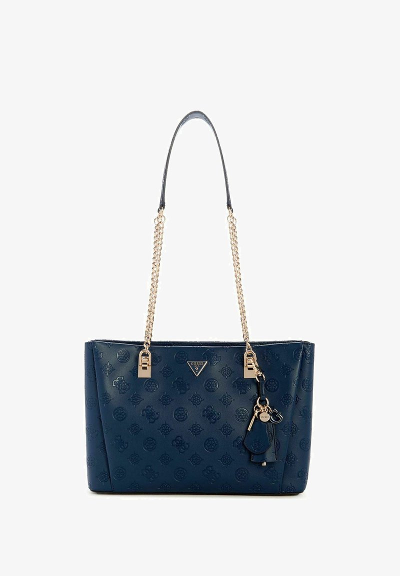 Sac à main synthétique bleu marine avec motif floral en relief, poignées chaîne dorées et détails logo. Comprend un porte-clés amovible.