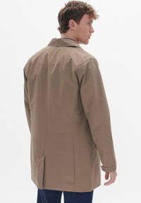 Brown, lightweight, flat-front coat with a single vent at the back, long sleeves, and a classic collar. Smooth texture, minimalistic design.