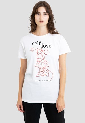 White cotton t-shirt featuring a red outline of Minnie Mouse and the text “self love.” below the illustration. Loose fit and round neckline.