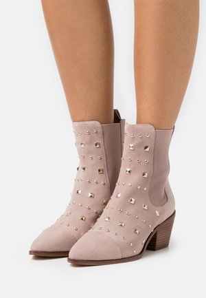 Copenhagen Shoes, Bottines de cowboy / motard - beige