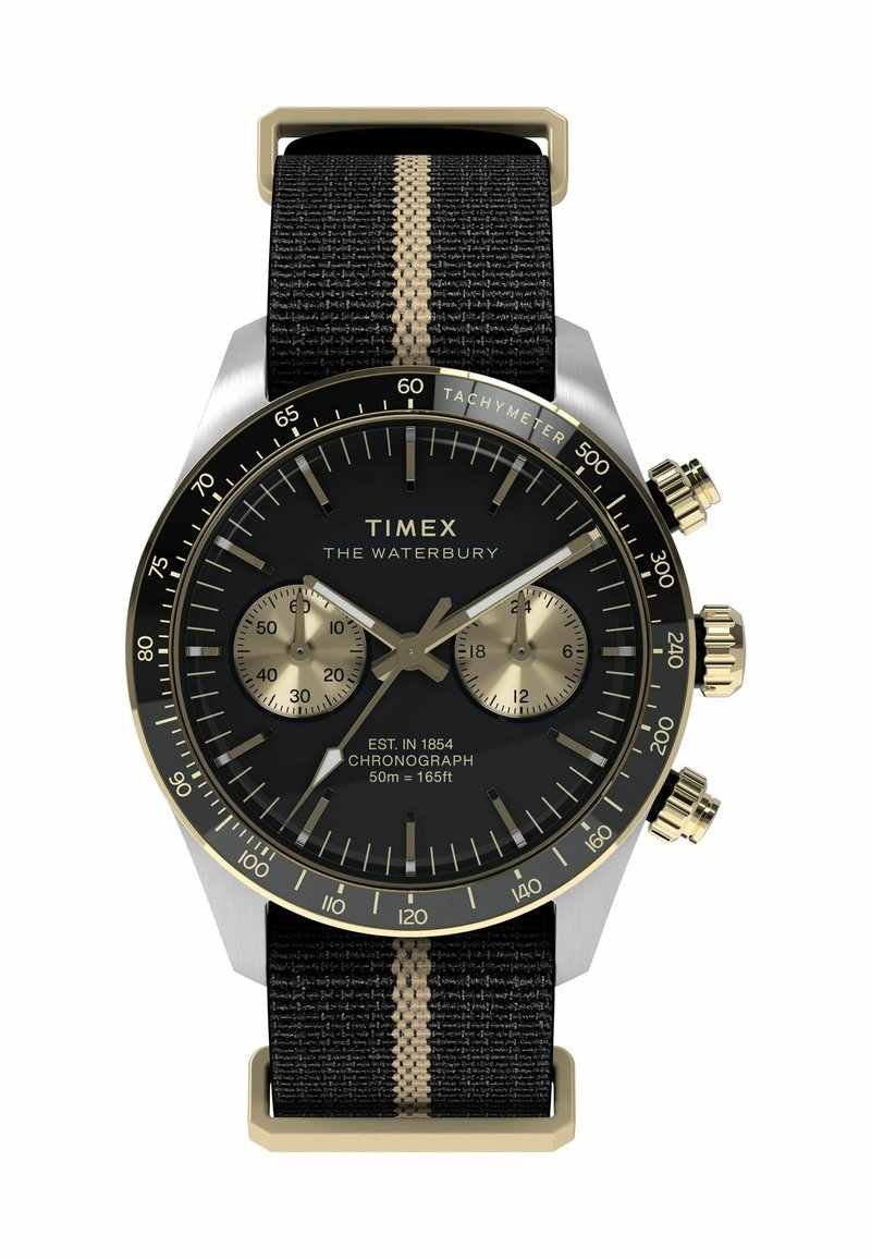 Timex Waterbury watch with a black dial, gold accents, chronograph features, and a black fabric strap with a vertical gold stripe.