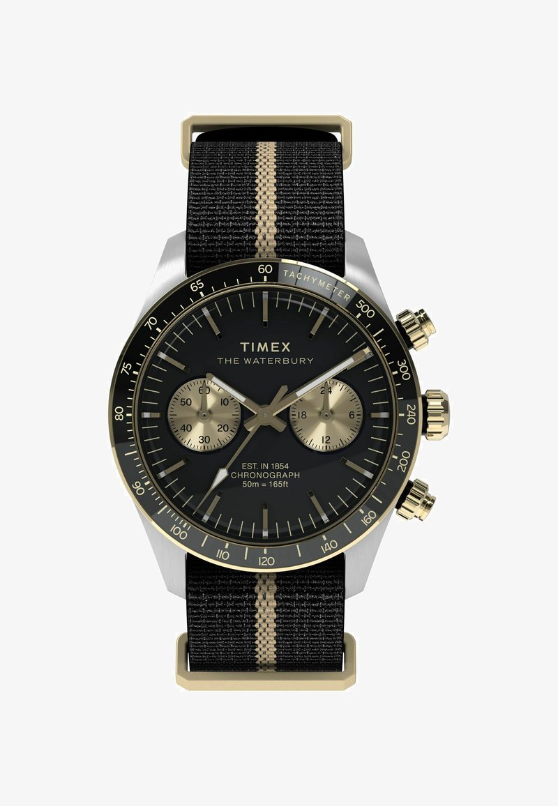 Timex Waterbury watch with a black dial, gold accents, chronograph features, and a black fabric strap with a vertical gold stripe.