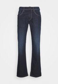 Donkerblauwe denim jeans met een uitlopende broekspijpdesign, met contrasterende witte stiksels, een knoopsluiting en vijf zakken.