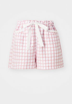 White and pink checkered shorts with a textured fabric, featuring an elastic waistband and a tied bow at the front. Two side pockets.