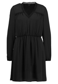 Svart klänning i lätt väv, med långa ärmar, V-ringning med spetsdetalj och elastisk midja för en bra passform.