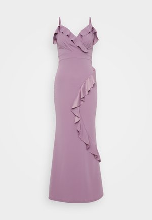 Lilla kjole med spaghetti stropper, der har en volangkrave og en diagonal volangdetalje langs siden. Glat, tætsiddende silhuet.