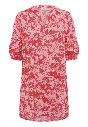 Punane lilleline tunika, millel on V-kaelus ja lühikesed puffvarrukad. Valmistatud kergest kangast, millel on roosa lillemuster punasel taustal.