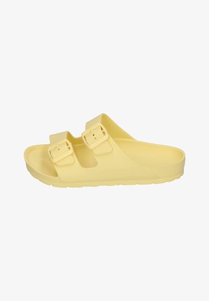 Yellow slip-on sandal with two adjustable straps, made of matte synthetic material. Features a contoured footbed and textured sole.