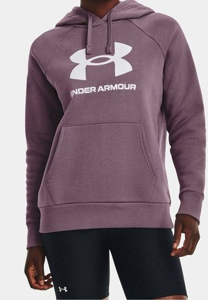 Person wearing purple Under Armour hoodie with front pocket and black shorts with Under Armour logo on left leg.