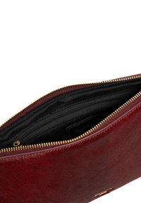 Burgundy leather pouch with a soft, textured exterior. Features a golden zipper and a black fabric-lined interior with an additional pocket.