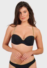 Black underwire bra with gold accents, featuring a smooth matte texture, plunge neckline, and adjustable thin straps.