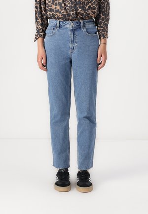 Light blue high-waisted jeans with a straight leg fit, featuring five pockets and a clean hem. Paired with black sneakers and a patterned top.